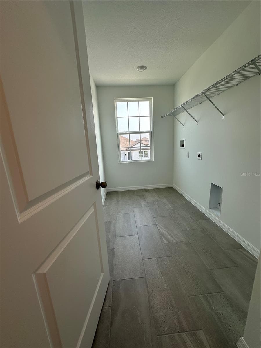 For ultimate comfort and convenience, this beautiful home includes a washer and dryer, thoughtfully located on the second floor for easy access to the bedrooms, making everyday laundry effortless! - 5714 CATTLE RANCH DR, ST CLOUD
