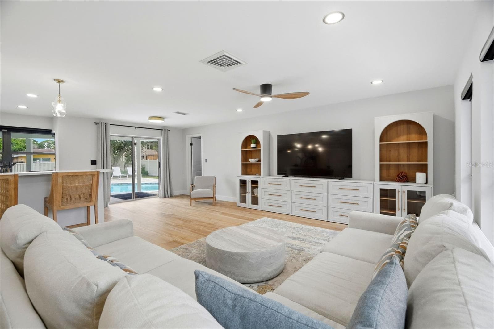 Living Room pointing toward Primary Bedroom and Eat-in Space next to Kitchen - 330 PATICA RD NE, ST PETERSBURG