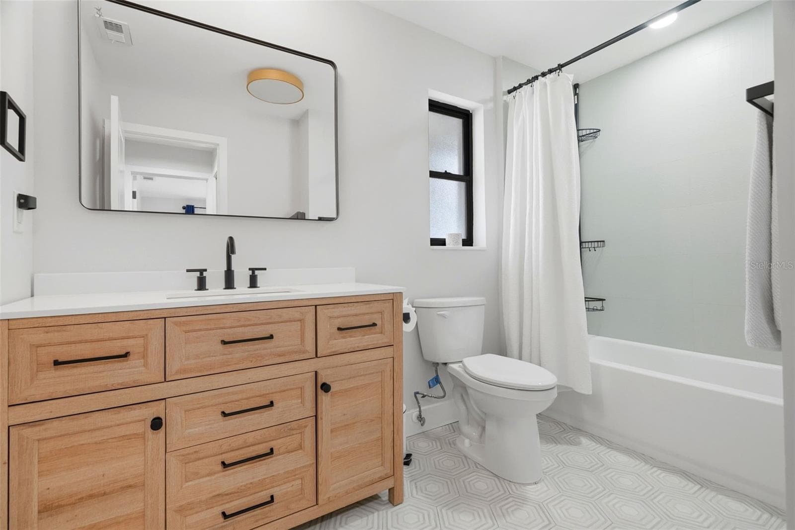 Guest Bathroom with Beautiful vanity and tile work - 330 PATICA RD NE, ST PETERSBURG