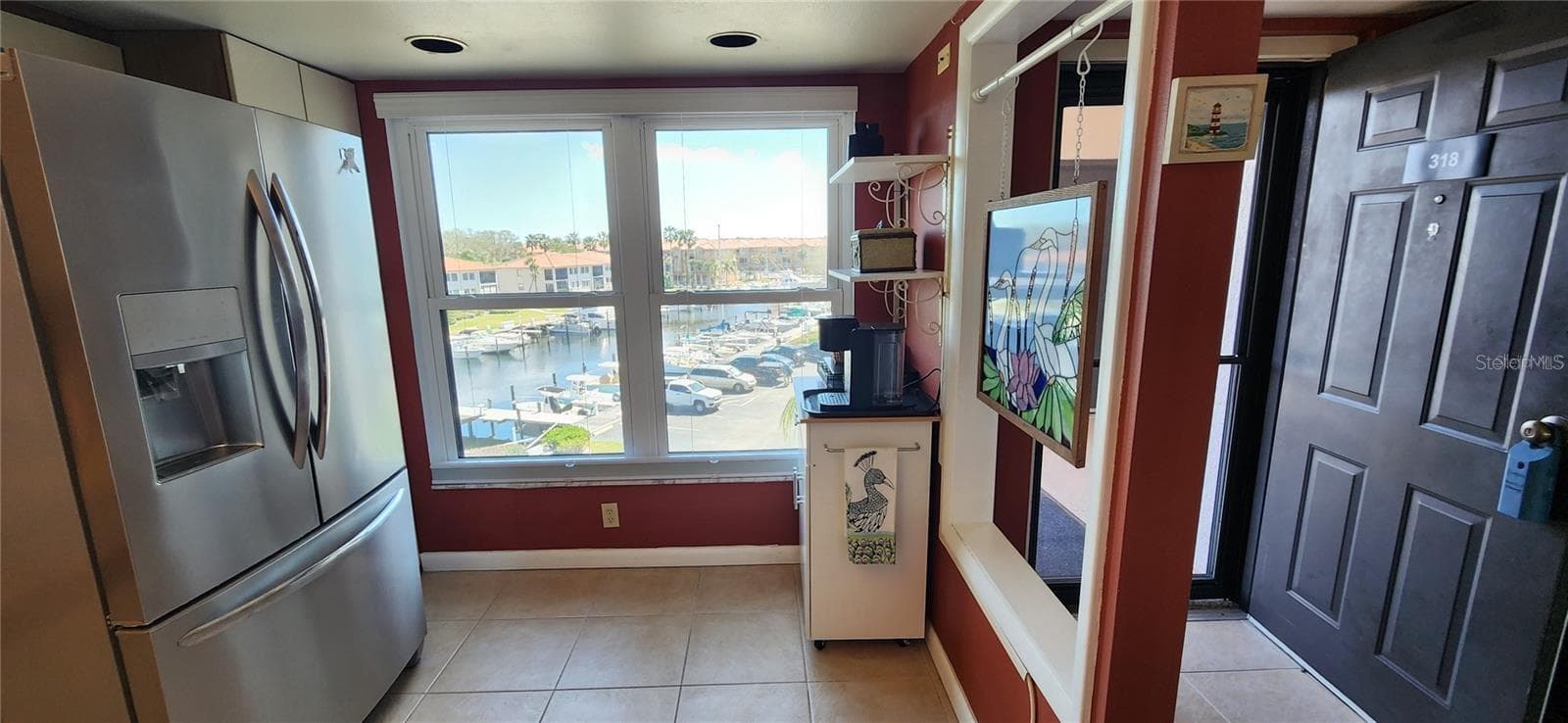 As you step through your front door, the kitchen's view of the marina allows you to check on your boat every morning or check activity going on in The Cove as you make your first cup of coffee.... - 1806 MARINER DR #318, TARPON SPRINGS
