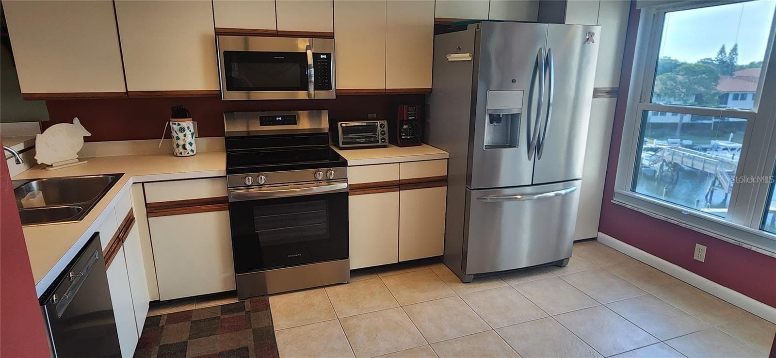 Lots of natural light and stainless steel appliances. - 1806 MARINER DR #318, TARPON SPRINGS