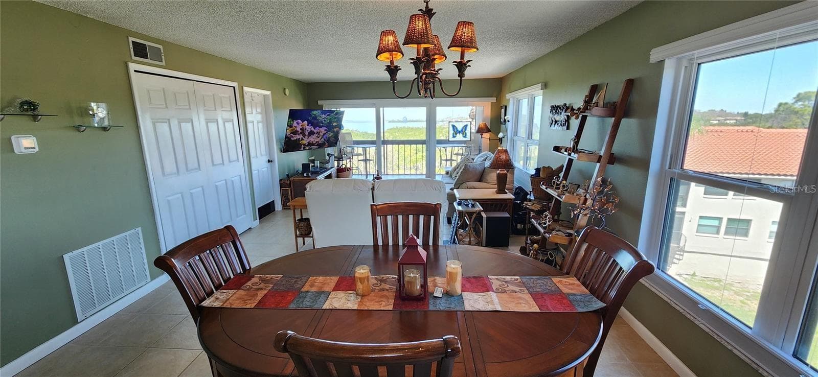 This end unit has wrap around light and views from the open dining and living area to the balcony. - 1806 MARINER DR #318, TARPON SPRINGS