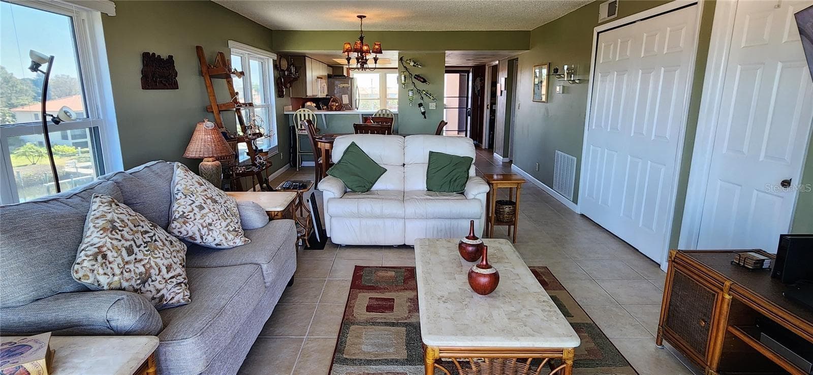 As an end unit, you will find  that the living and dining area, as well as the kitchen, have plenty of natural light. - 1806 MARINER DR #318, TARPON SPRINGS
