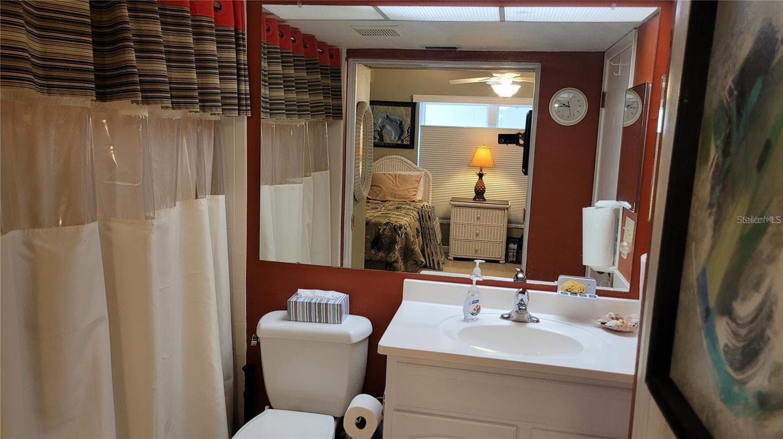 The guest bath has wide pocket door entry from the bedroom making it a suite, plus an entry from the hallway. - 1806 MARINER DR #318, TARPON SPRINGS