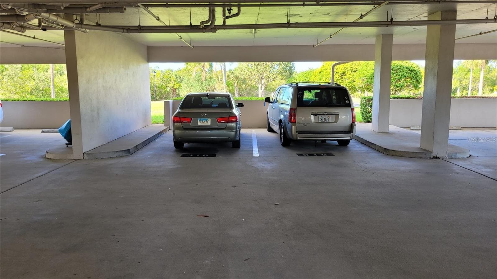 On your way in or out of 1806, you will find your under building assigned parking space. Great for Florida's deluge rains! - 1806 MARINER DR #318, TARPON SPRINGS
