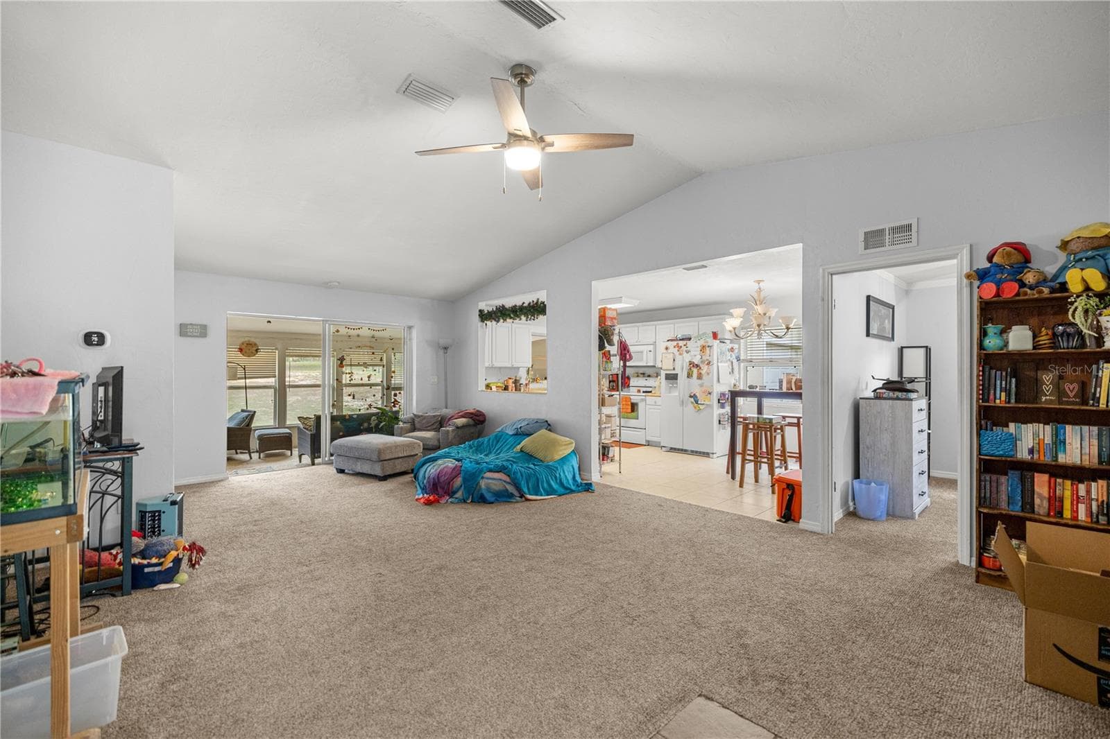 FROM FOYER LOOKING THRU LIVING AREA TO SUNROOM & KITCHEN - 7910 SW 202ND CT, DUNNELLON