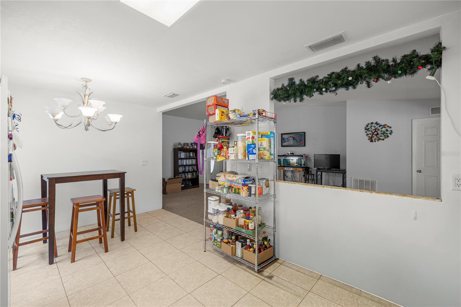 KITCHEN TO LIVING BREAKFAST BAR - 7910 SW 202ND CT, DUNNELLON