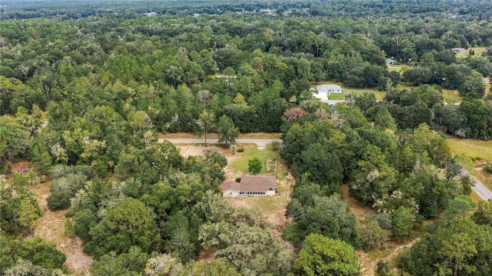 from west to east over rear of property & sunroom - 7910 SW 202ND CT, DUNNELLON