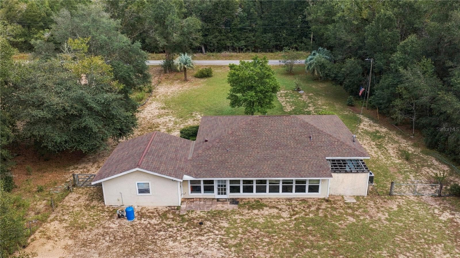 REAR OF HOME FROM ABOVE IN THE WESTERLY SKY - 7910 SW 202ND CT, DUNNELLON