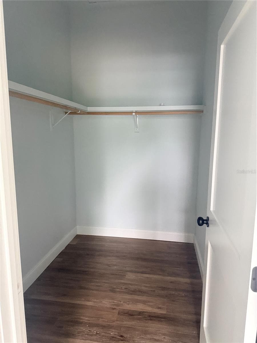 Primary walk in closet - 2410 LAKE TINY RD, DELTONA
