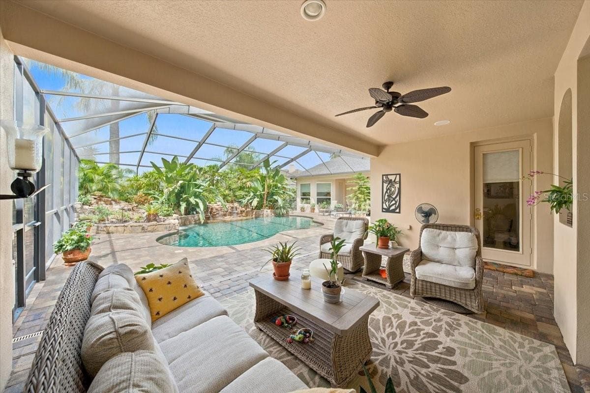 Pool, lanai, pavers, and tropical landscaping create an exceptional setting for gatherings. - 5513 KEELER OAK ST, LITHIA