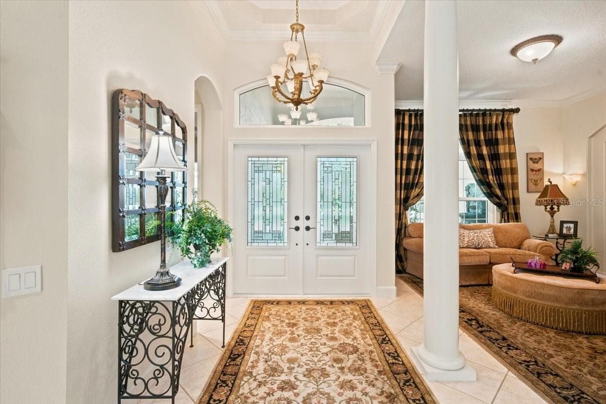 Welcoming entrance introduces the home's impressive scale and custom design. - 5513 KEELER OAK ST, LITHIA