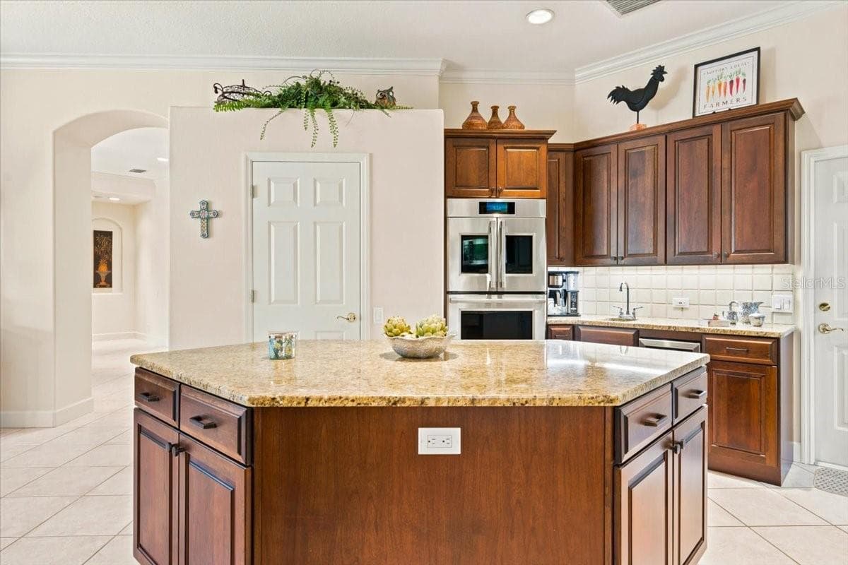 Abundant cabinetry provides excellent storage and workspace. - 5513 KEELER OAK ST, LITHIA