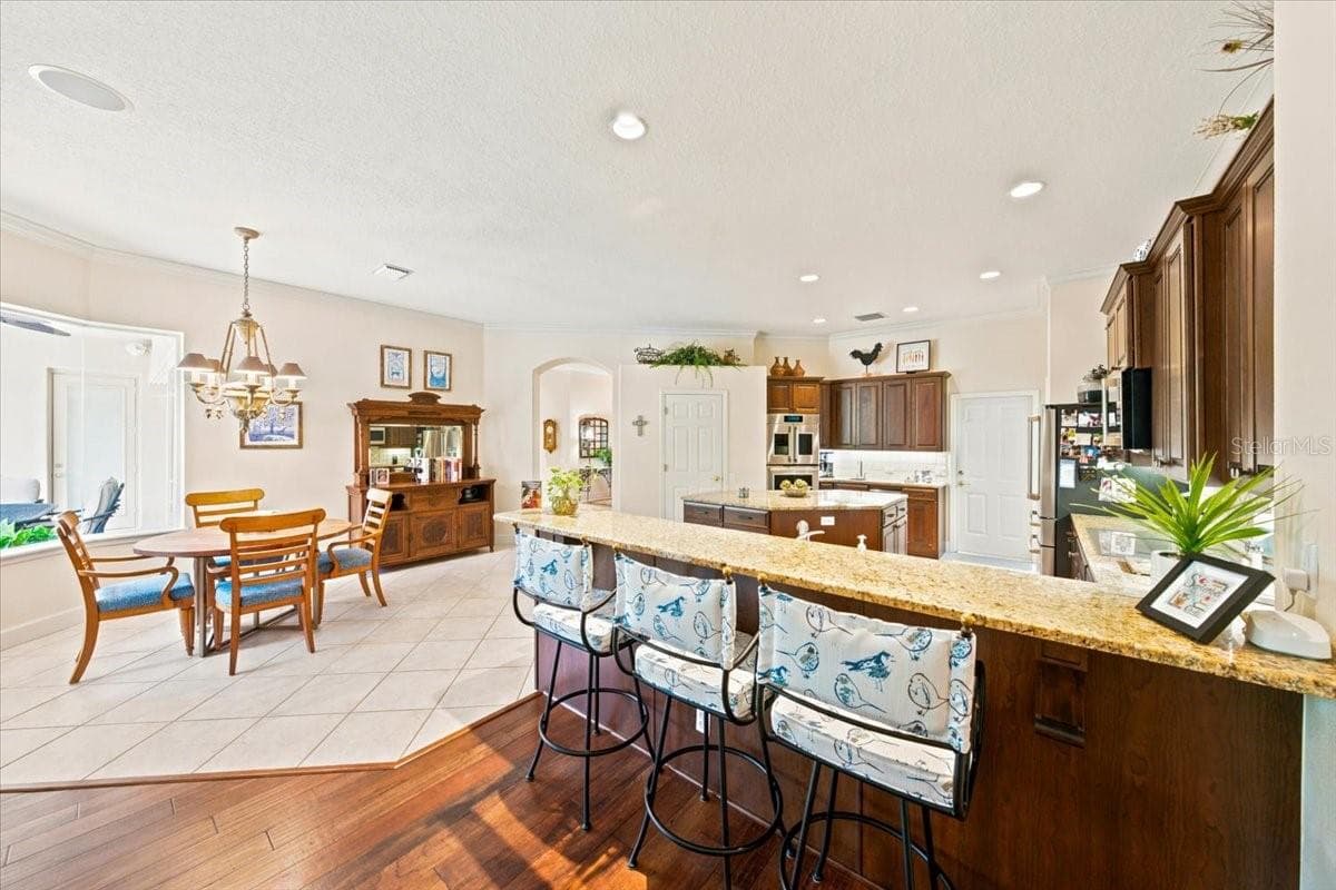Open connection keeps the kitchen integrated with the main gathering space. - 5513 KEELER OAK ST, LITHIA