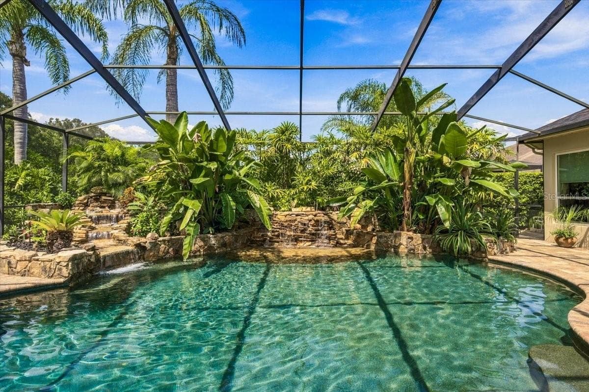 PebbleTec finish adds a distinctive, upscale detail to the pool. - 5513 KEELER OAK ST, LITHIA