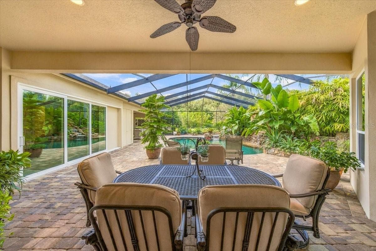 Covered outdoor area provides a comfortable setting for dining and relaxing - 5513 KEELER OAK ST, LITHIA