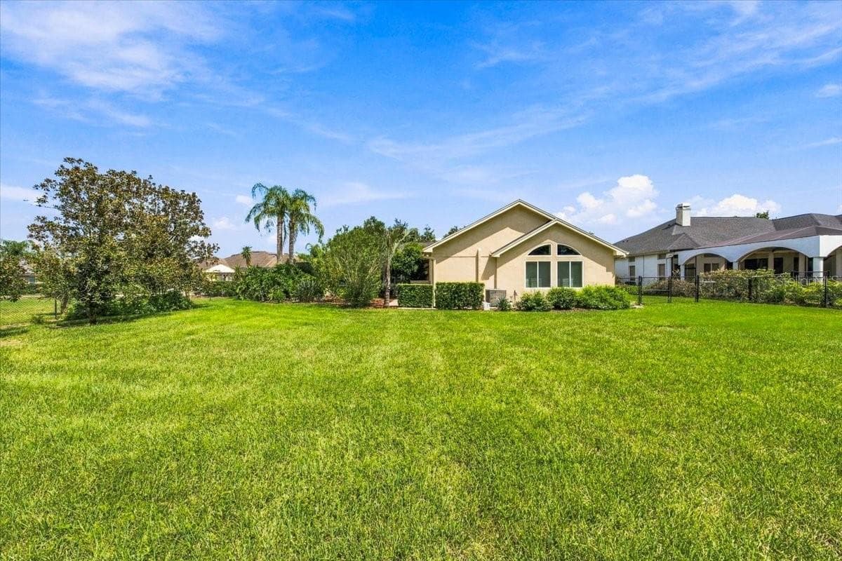 Dedicated landscape lighting highlights the property's outdoor features. - 5513 KEELER OAK ST, LITHIA