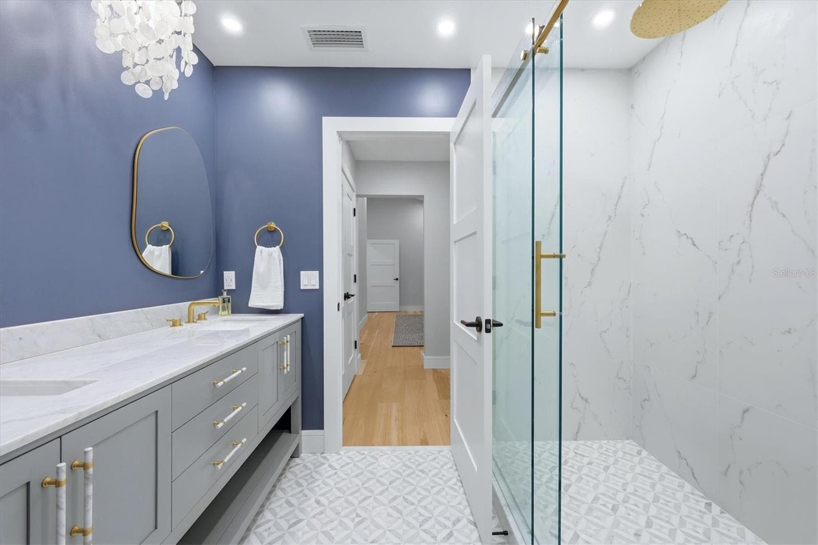 Primary Bathroom with Double Sinks and Carerra Marble vanity top and glass enclosure shower - 2141 HARBOURSIDE DR #1203, LONGBOAT KEY