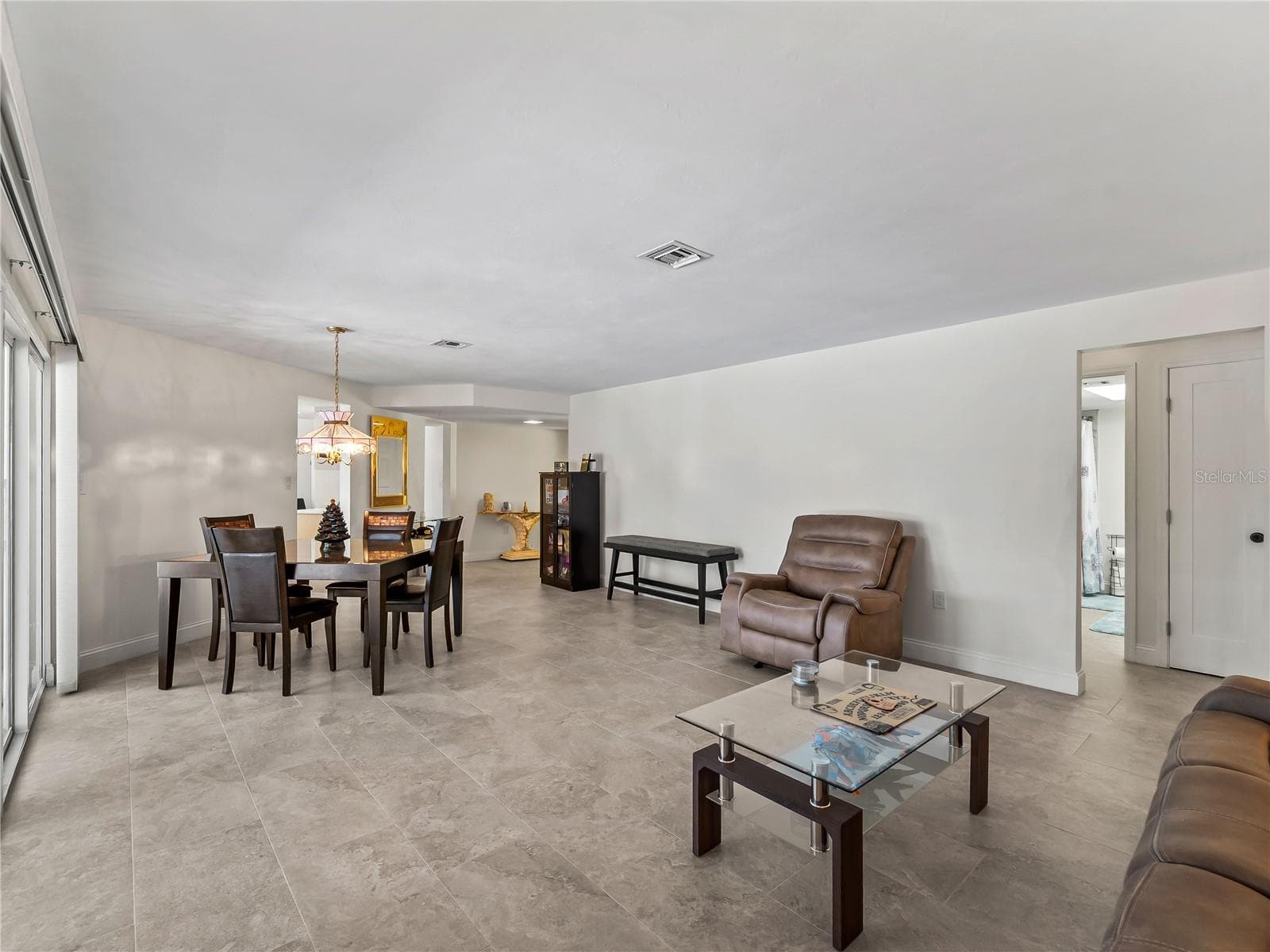 DiningLiving_2903rdStreet_BonitaSprings_NaturalLight_Corner.jpg - 290 3RD ST W, BONITA SPRINGS