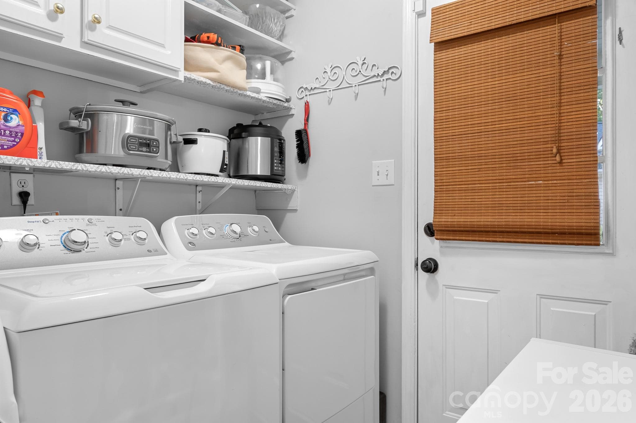 Laurndry Room/Utility room with door leading to covered walkway to the driveway pad. Perfect for brining in the groceries or leaving your wet boots! - 4126 Medford Drive NW, Concord
