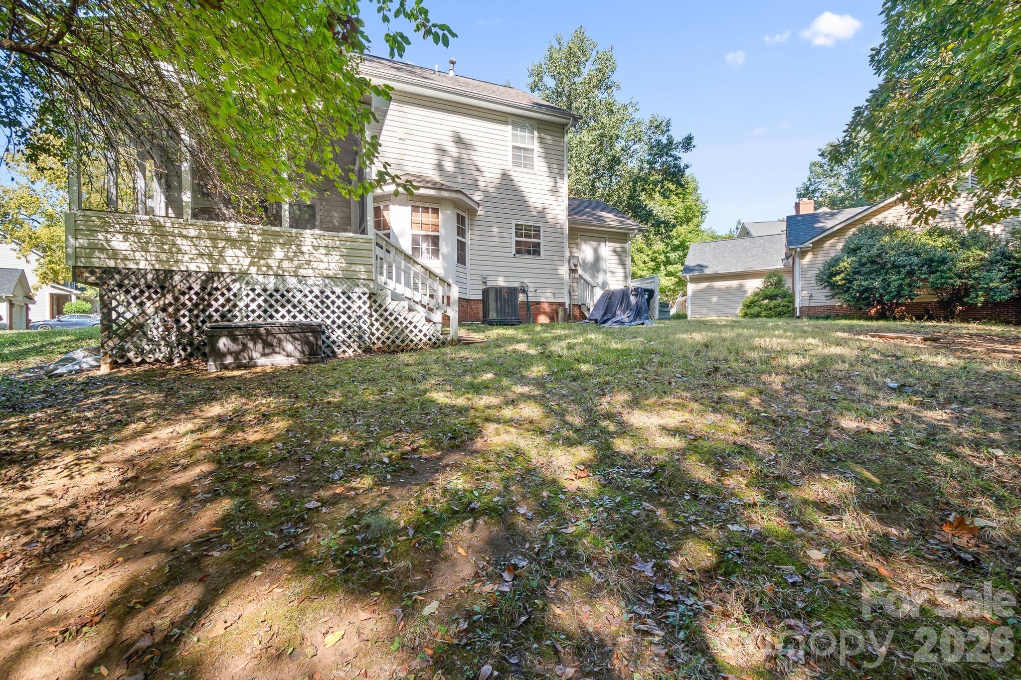 Back of home and backyard area. Screened porch with a few stairs leading to a spacious backyard area! So many possibilites with this yard as well! Add a Patio, firepit or Hot Tub area.... Endless ideas! - 4126 Medford Drive NW, Concord