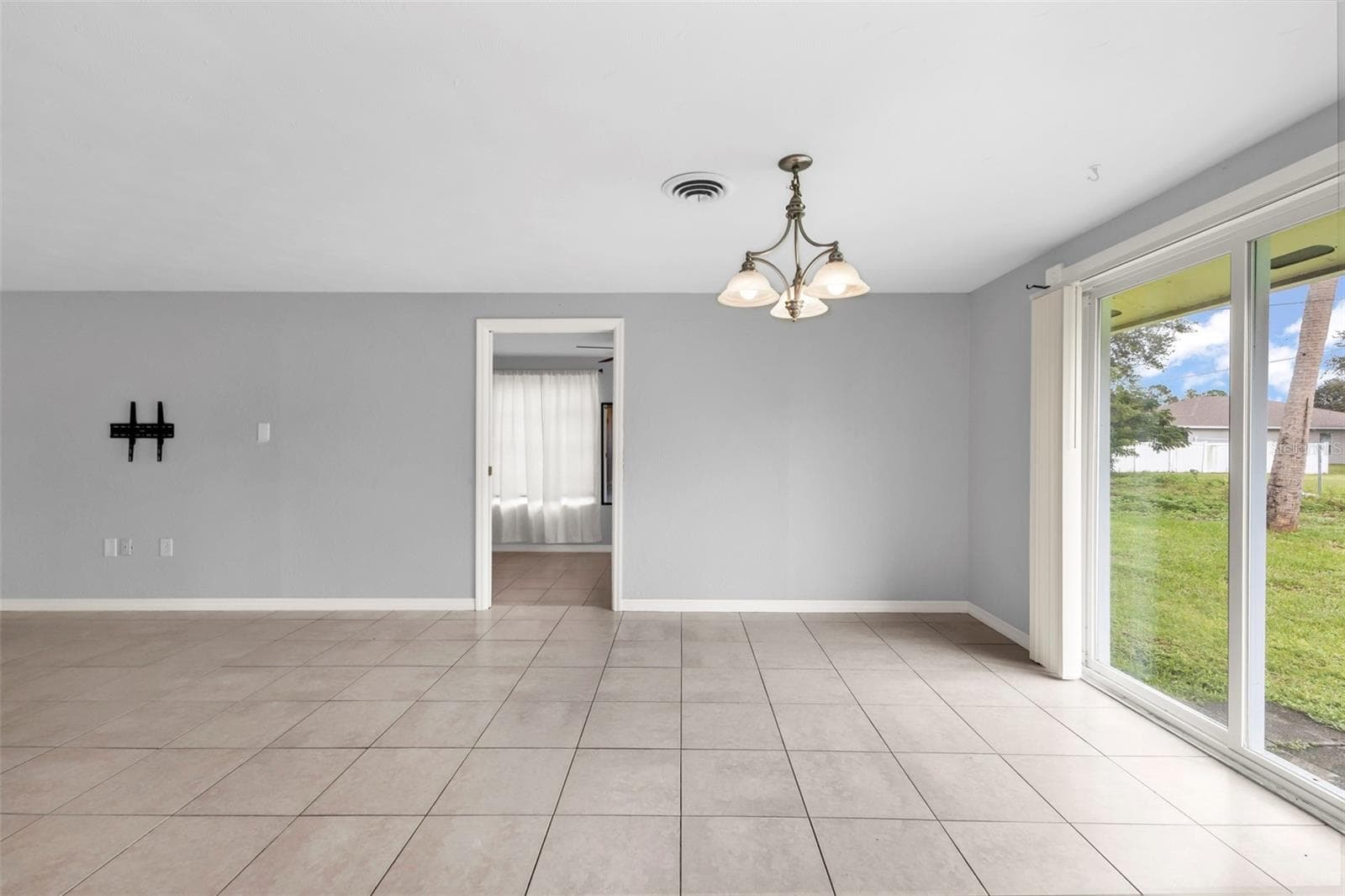 View of dining room where 3rd bedroom is located. - 424 VANNELL ST, PORT CHARLOTTE