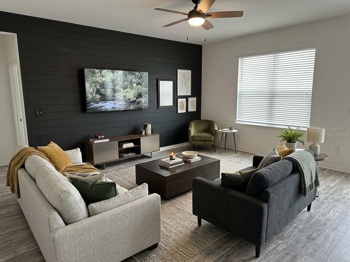 Virtually staged Living room - 2500 BEGONIA ST, MASCOTTE
