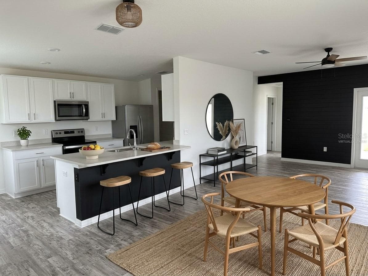Virtually Staged Kitchen/Nook - 2500 BEGONIA ST, MASCOTTE