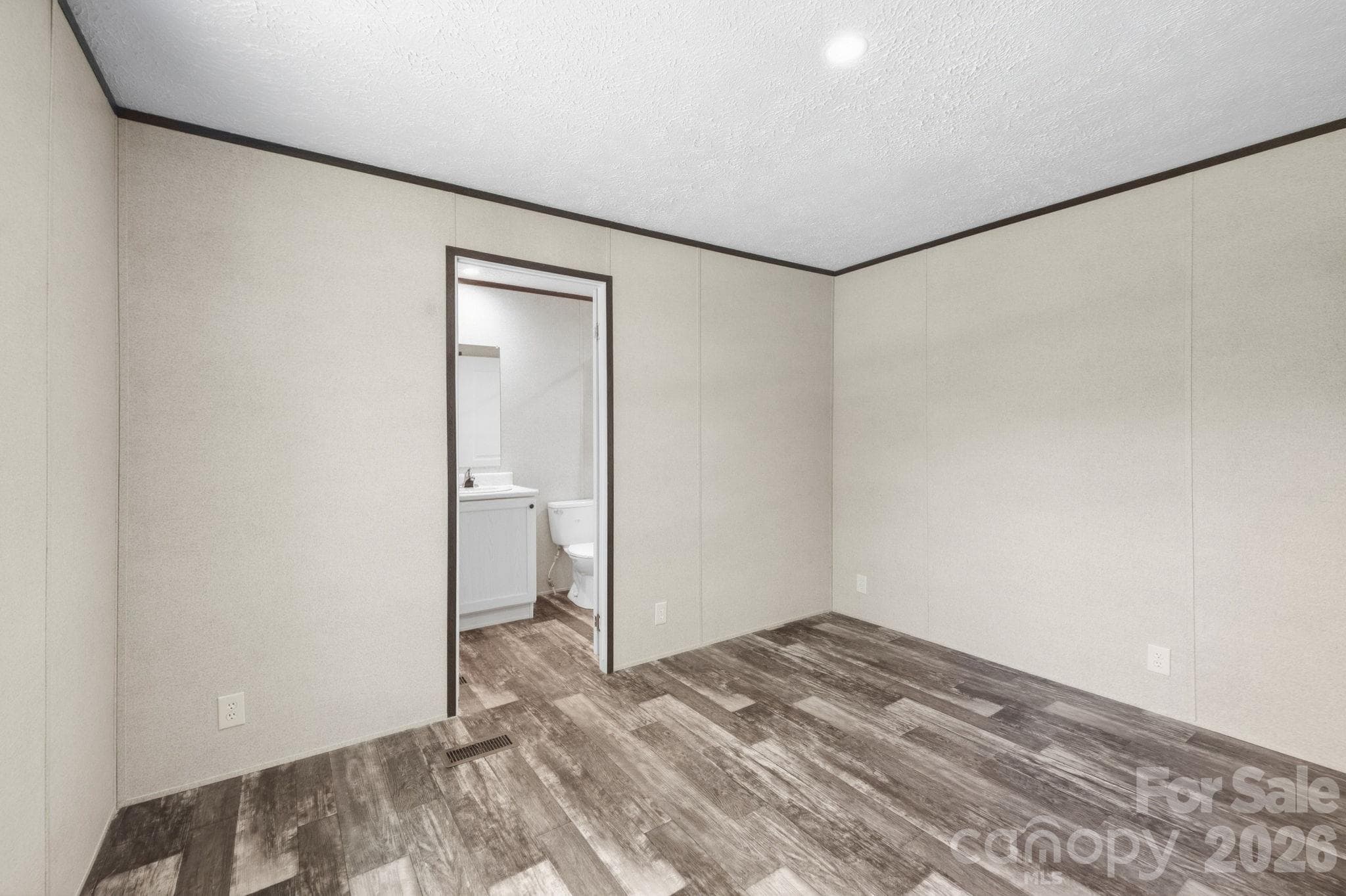 Primary bedroom has access to the primary bath. - 85 Trent Road, Brevard