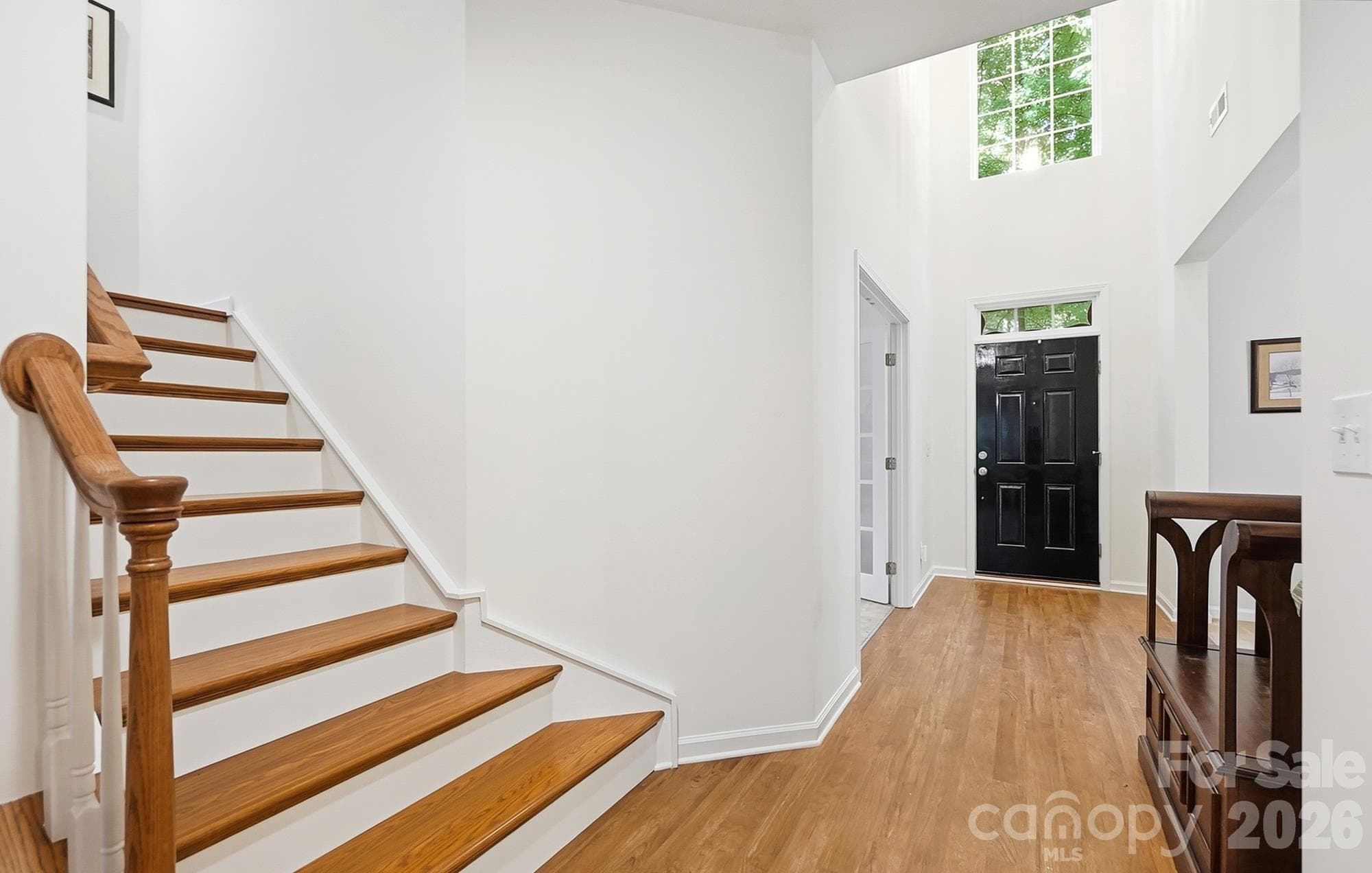 Hardwoods leading upstairs - 2100 Pineapple Court, Matthews