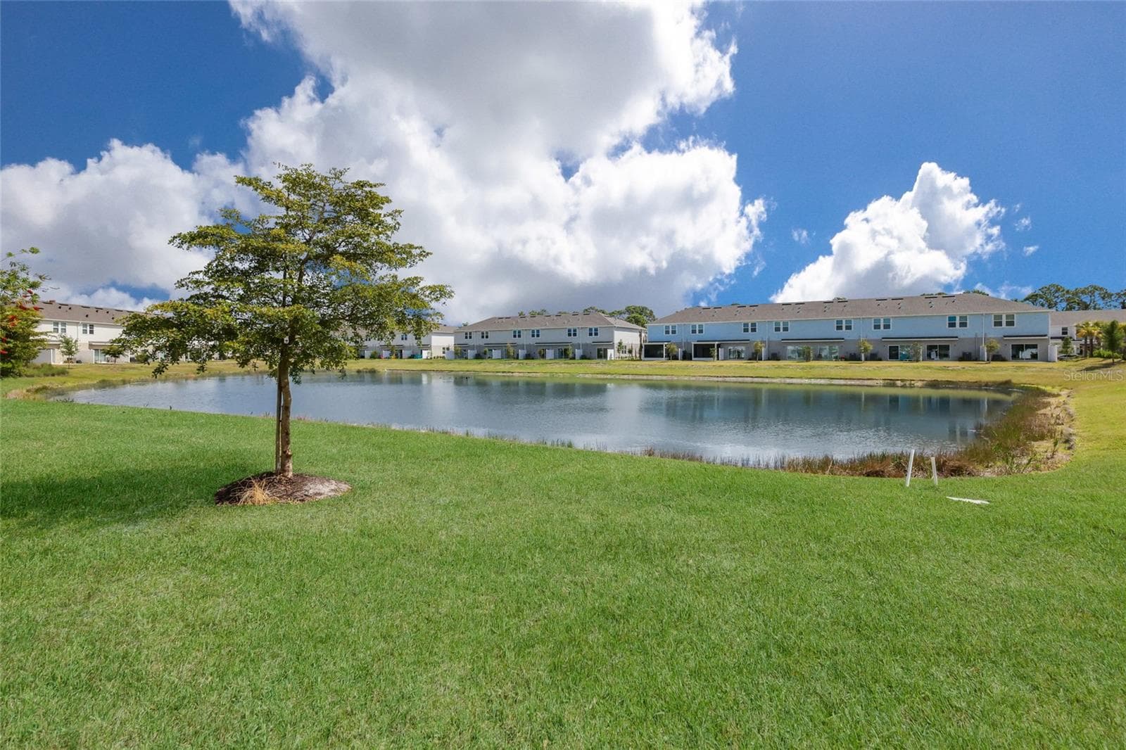 The views of the community lake from the patio are simply stunning! - 15150 GINETTI ST, NOKOMIS