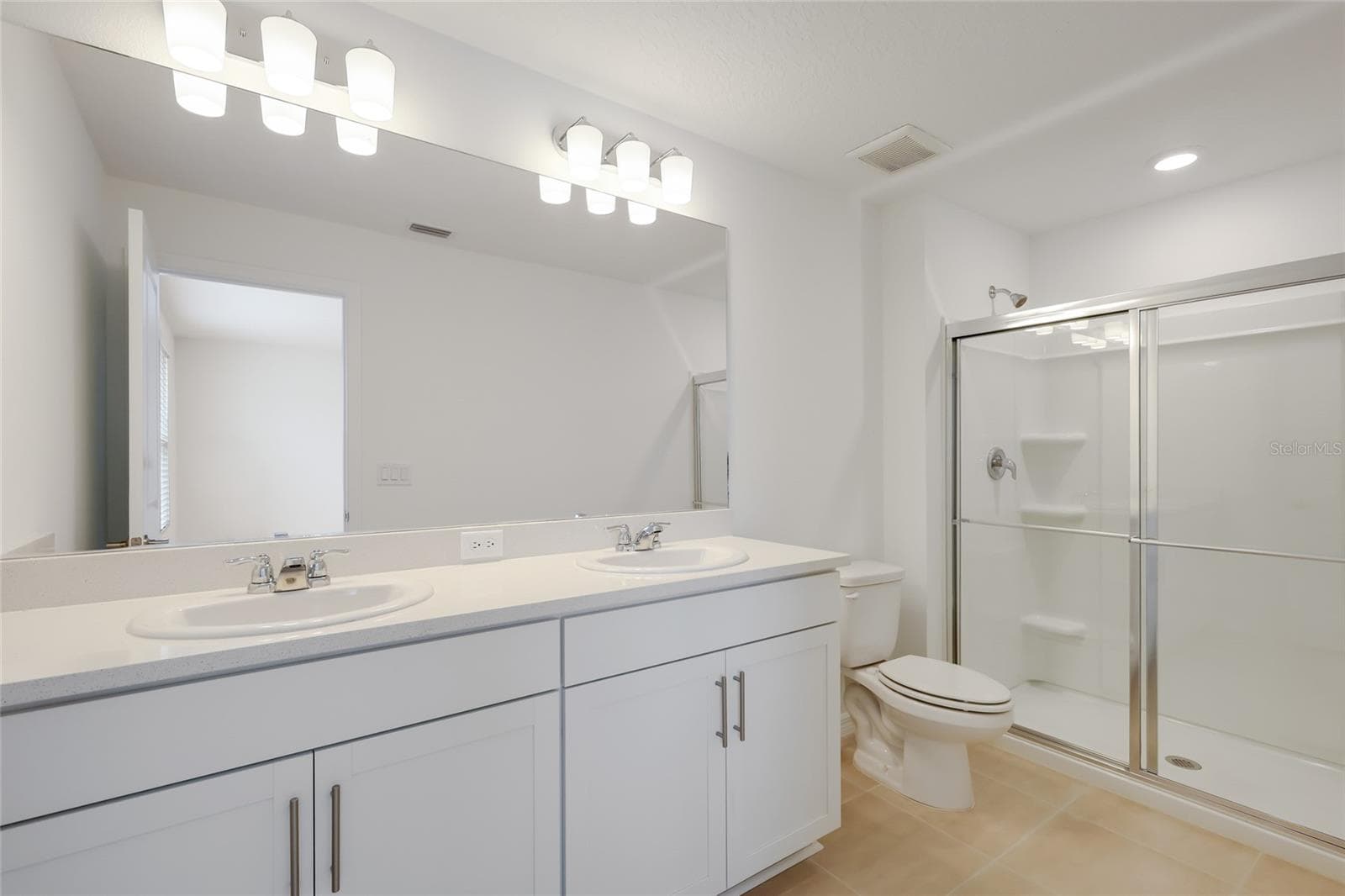 The master bathroom has a large double vanity providing ample space for two people to share to get their day started! - 15150 GINETTI ST, NOKOMIS