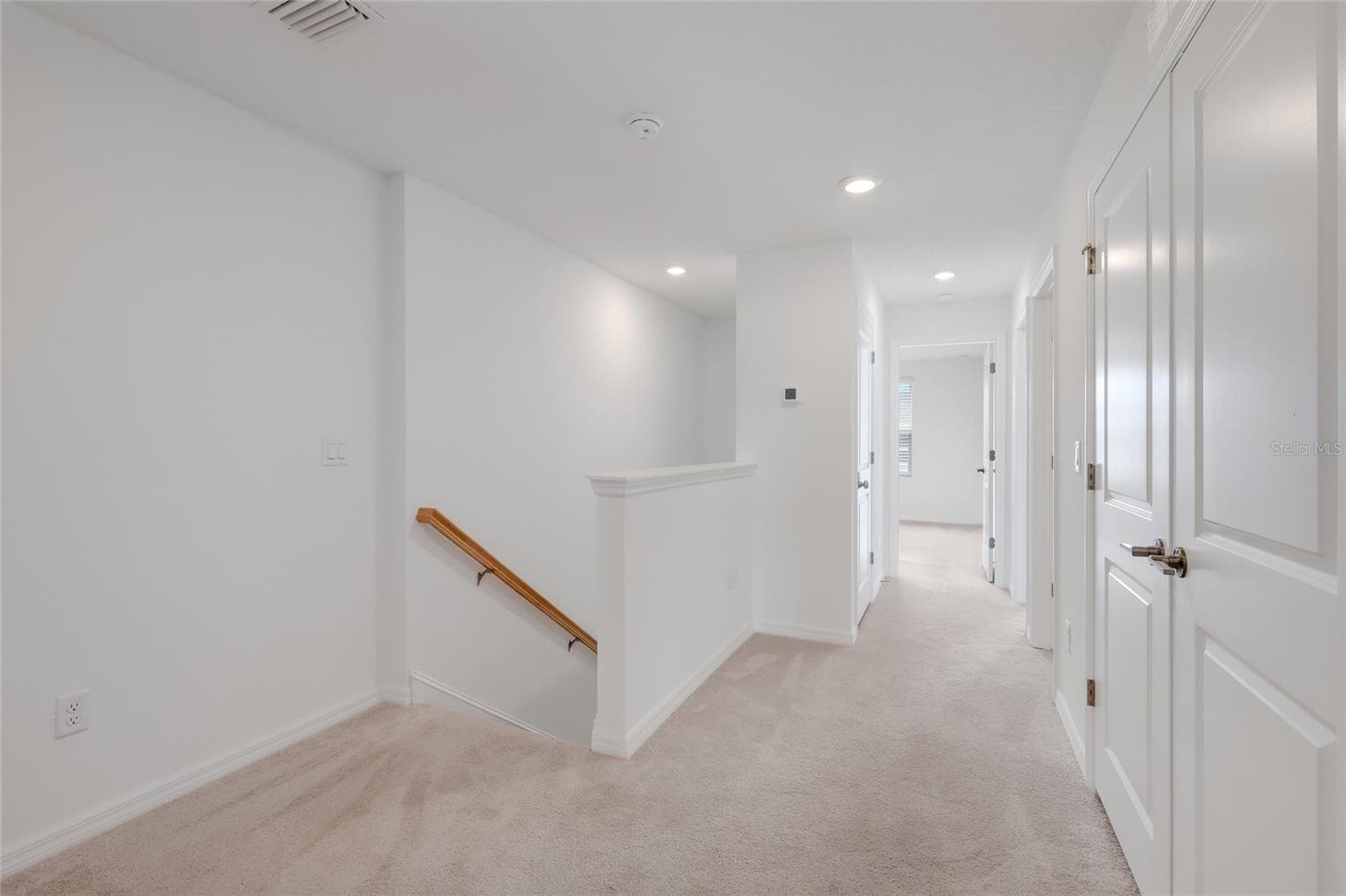 At the other end of the loft is the entrance to the other two bedrooms as well as the hall bathroom. Again, there is even more space for a small bench or another small work station area! - 15150 GINETTI ST, NOKOMIS