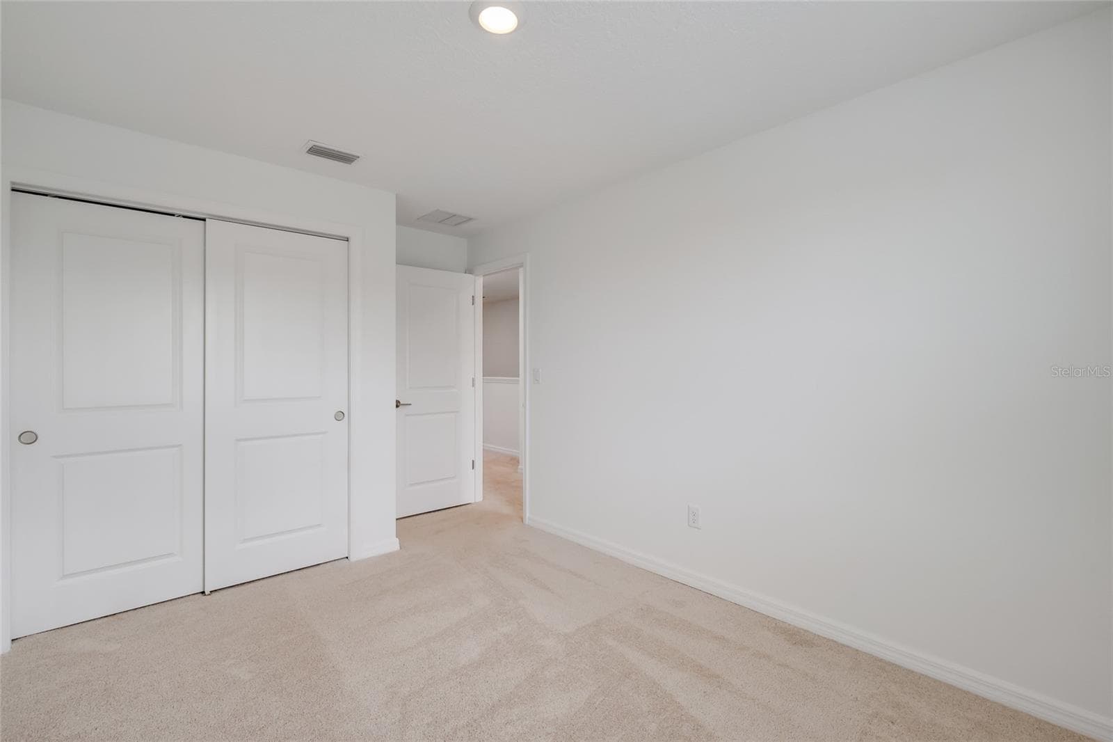 The large second bedroom provides plenty of space for children and/or guests and has a large closet and easy access to the hall bathroom! - 15150 GINETTI ST, NOKOMIS