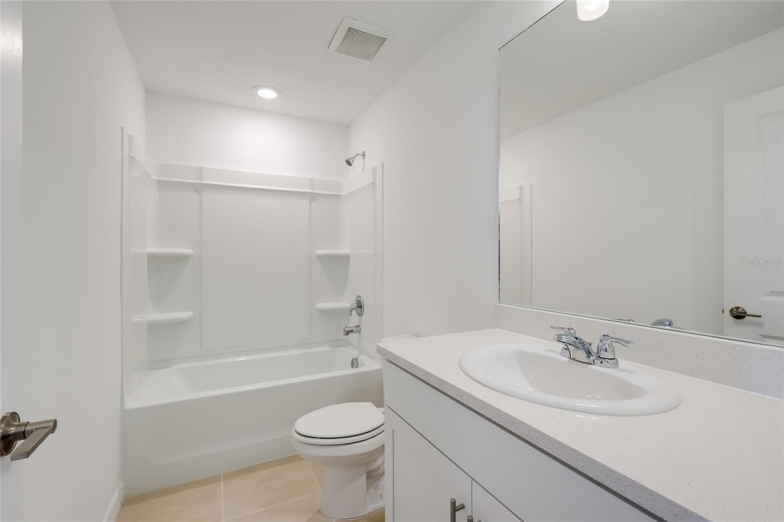 The hall bathroom is perfectly situated for use by those utilizing bedrooms 2 and 3 and has a linen closet situated just outside of the door! The tub/shower combination is perfect for any use! - 15150 GINETTI ST, NOKOMIS