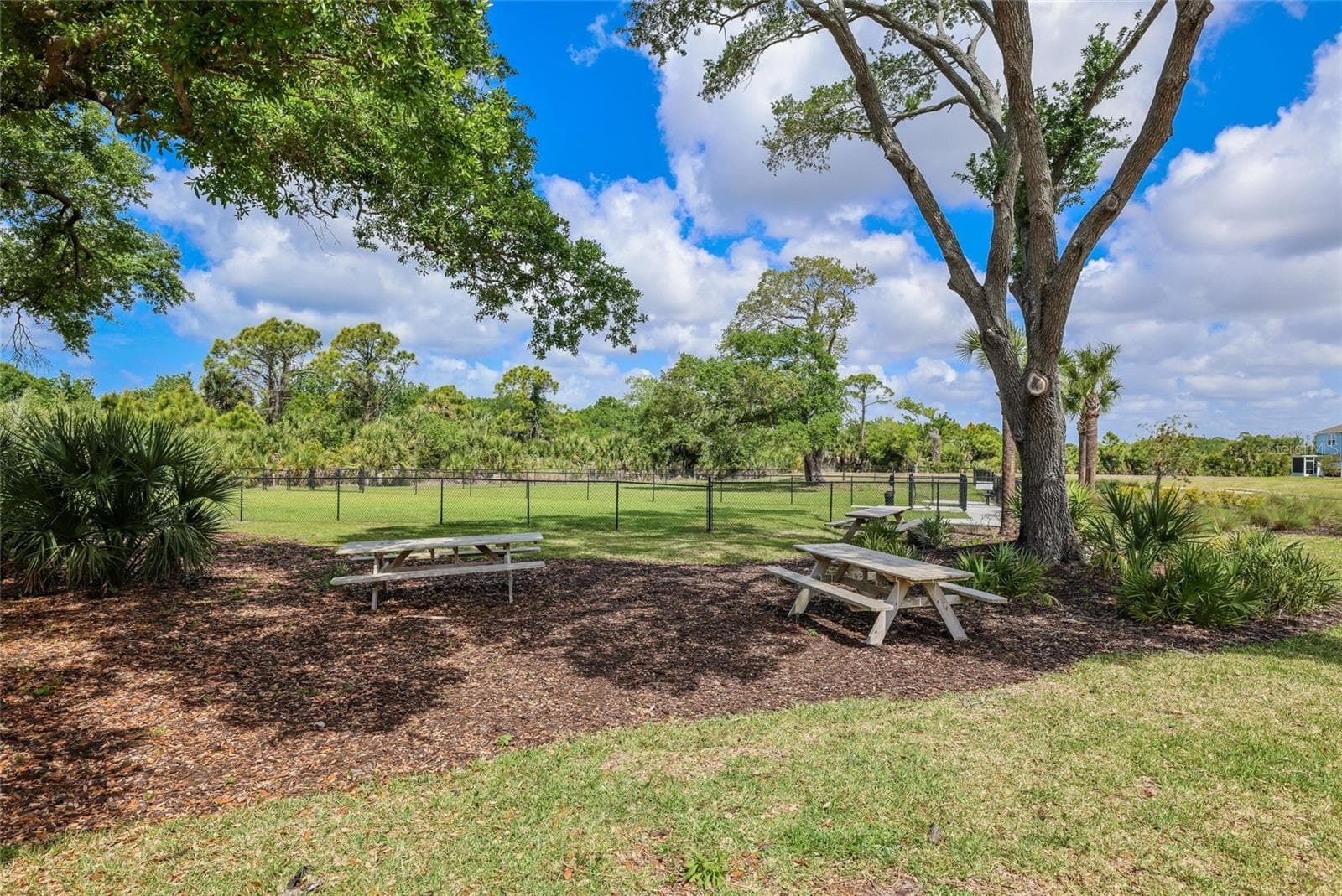 A picnic area is located just outside of the dog park to enjoy a nice outdoor family barbeque! - 15150 GINETTI ST, NOKOMIS
