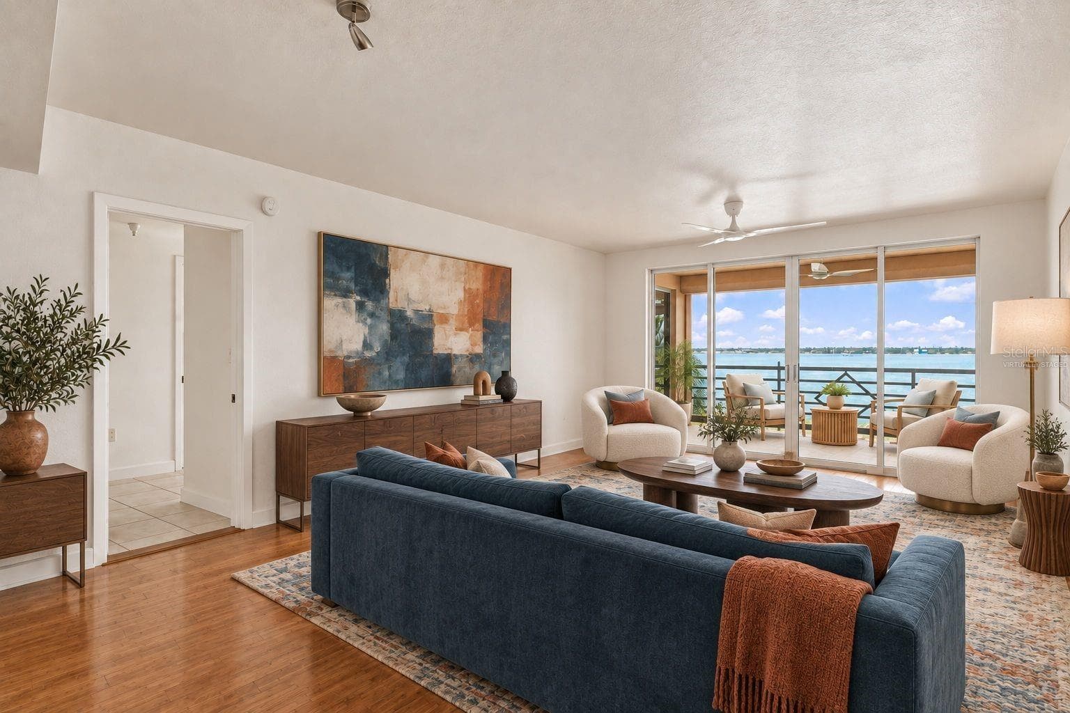 Living room virtually staged - 4993 BACOPA LN S #304, ST PETERSBURG