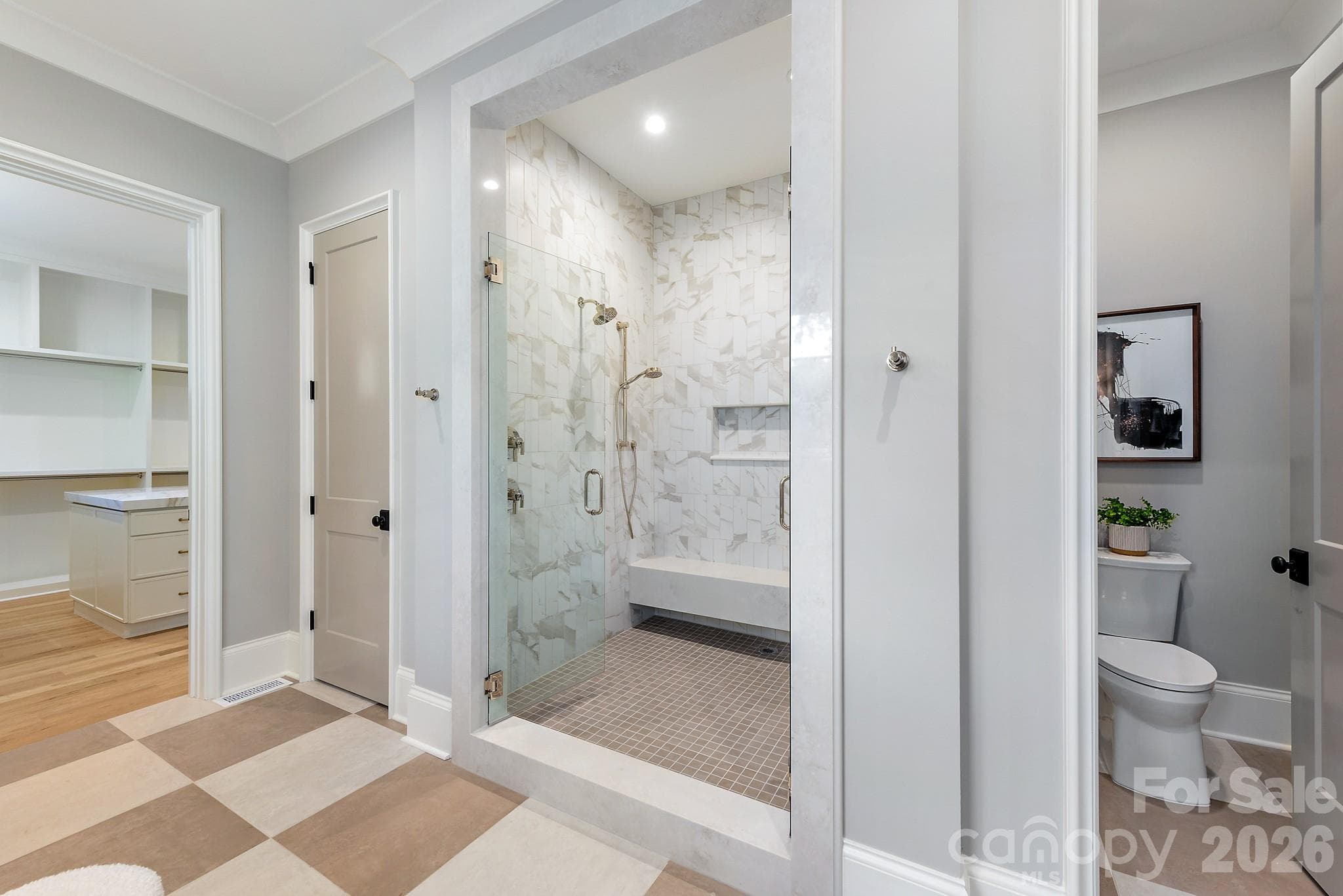 Main level primary suite with walk in shower. - 133 Wonderwood Drive, Charlotte
