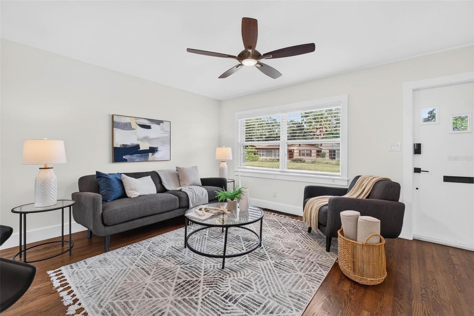 Cozy living room had cove ceilings removed & ceiling replaced. - 3312 MELTON ST N, ST PETERSBURG