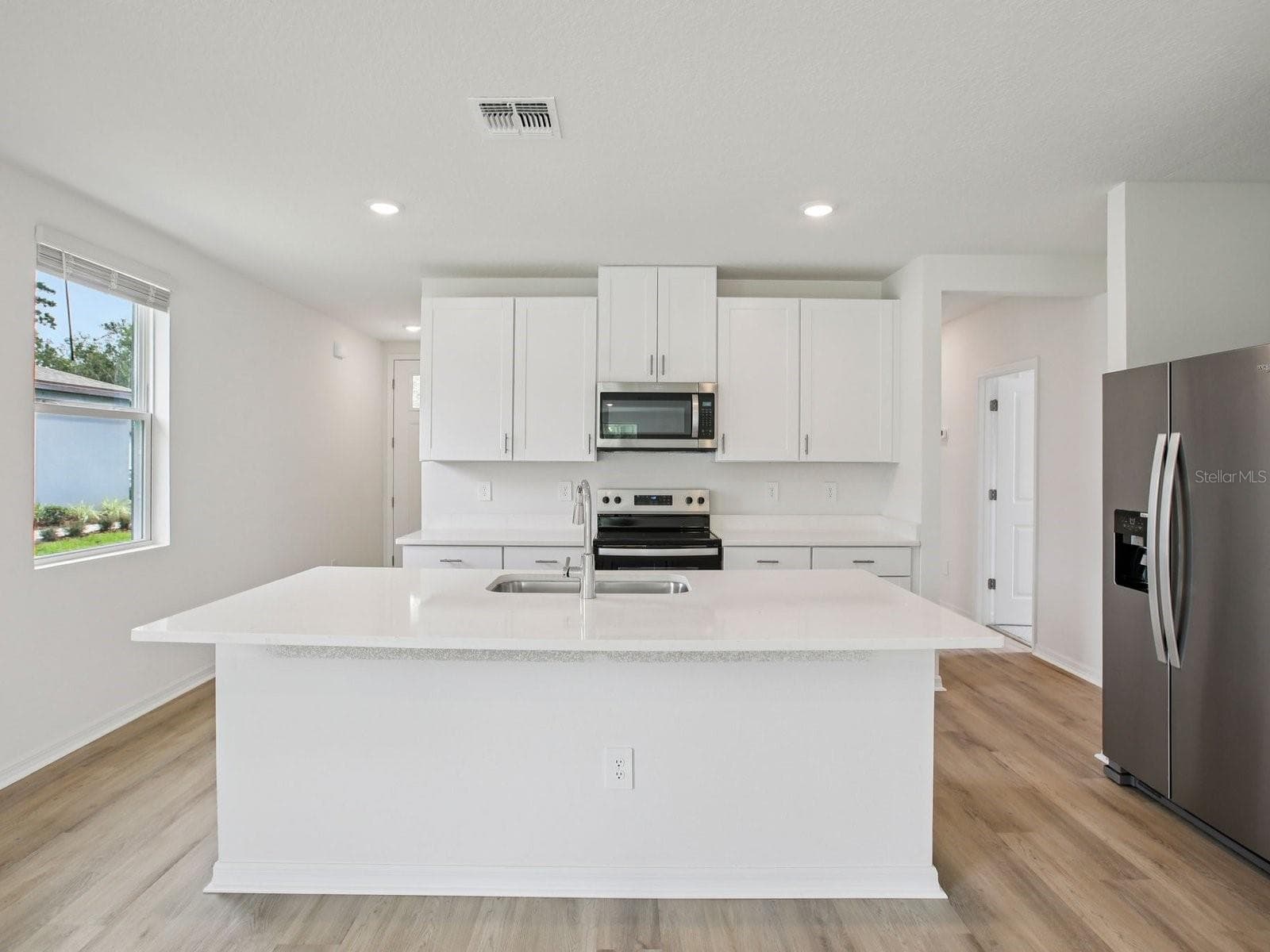 Photo is not of the actual home but of a builder home with same floorplan with similar interior finishes. - 3818 MOSCATO DR, BROOKSVILLE