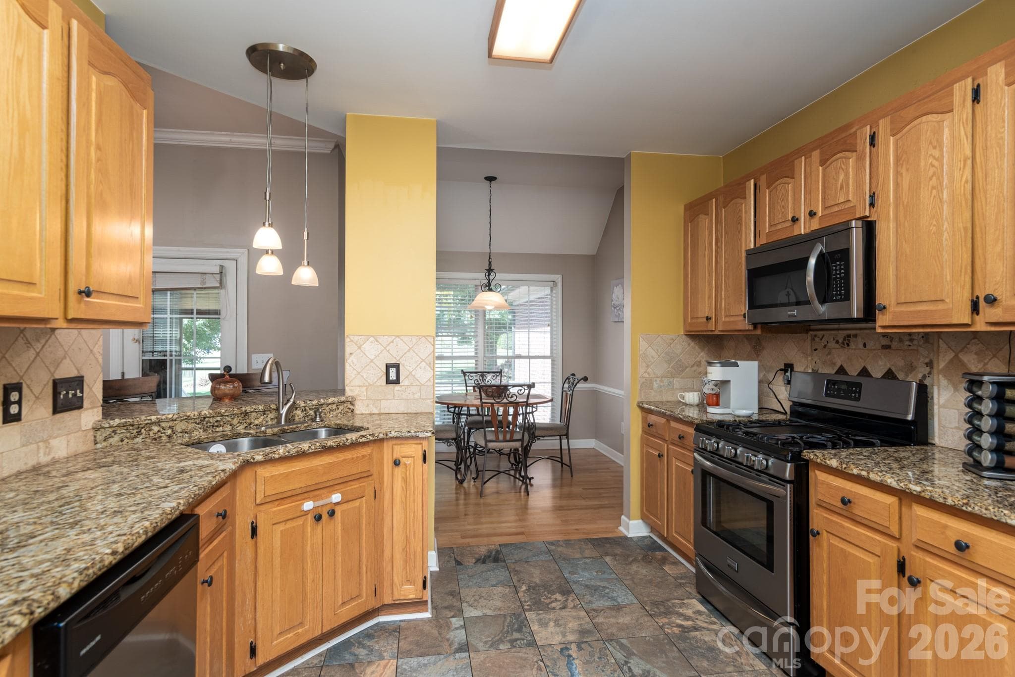Kitchen with granite counters and tiled splash - 2915 Woodfield Lane, Lincolnton