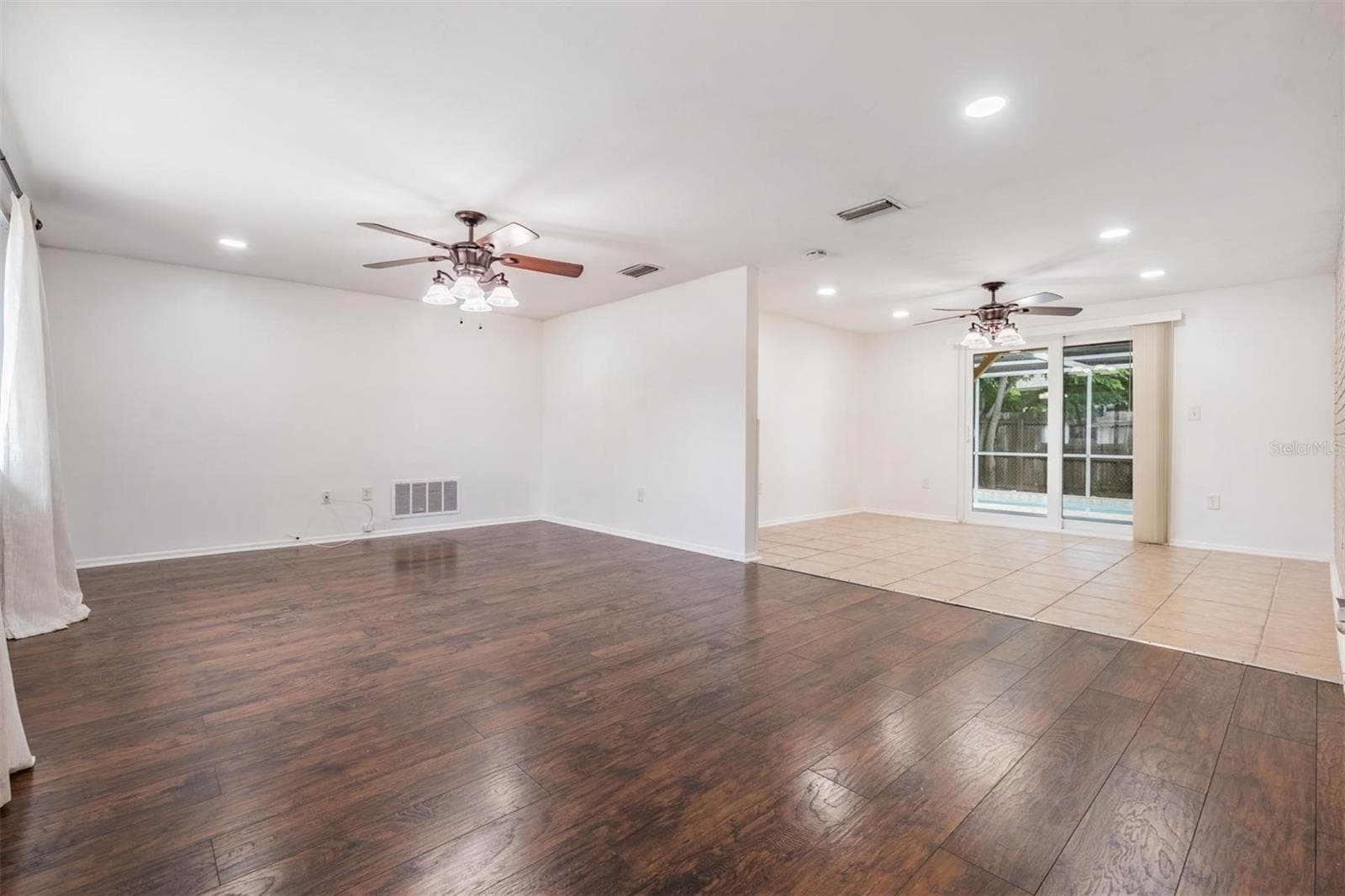 Large open concept layout with living and dining room combo - 7700 BIRCHWOOD DR, PORT RICHEY