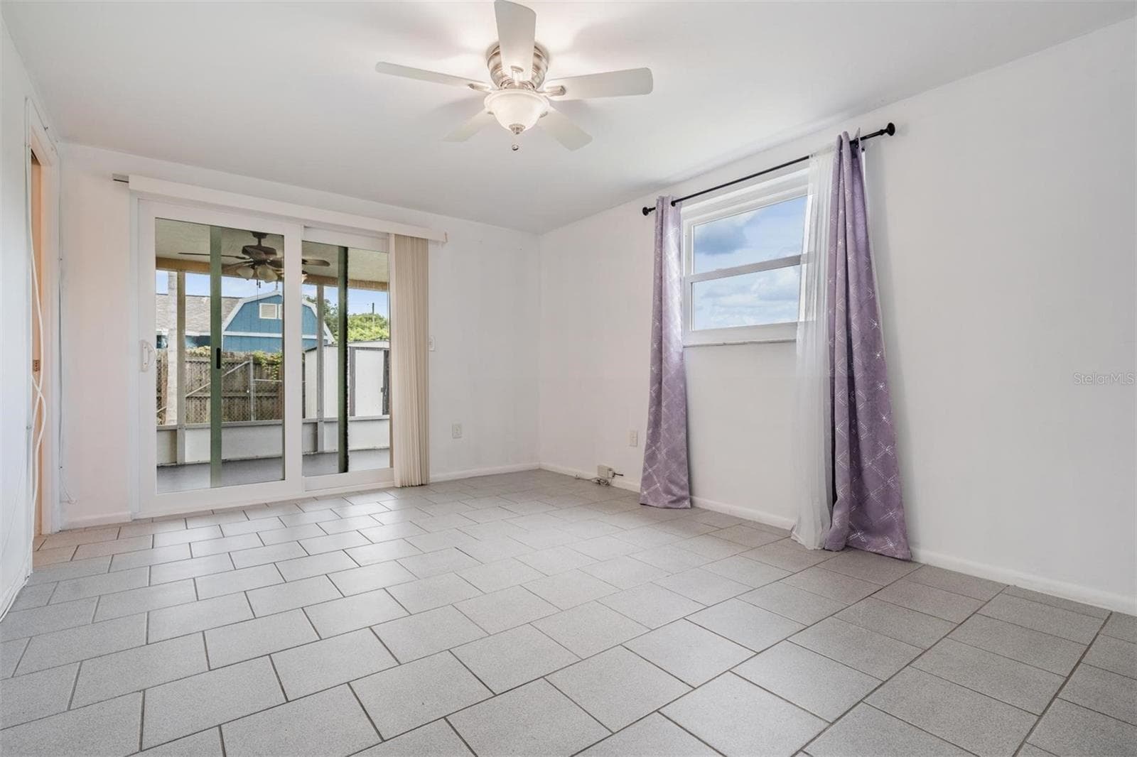 Primary bedroom with pool access - 7700 BIRCHWOOD DR, PORT RICHEY