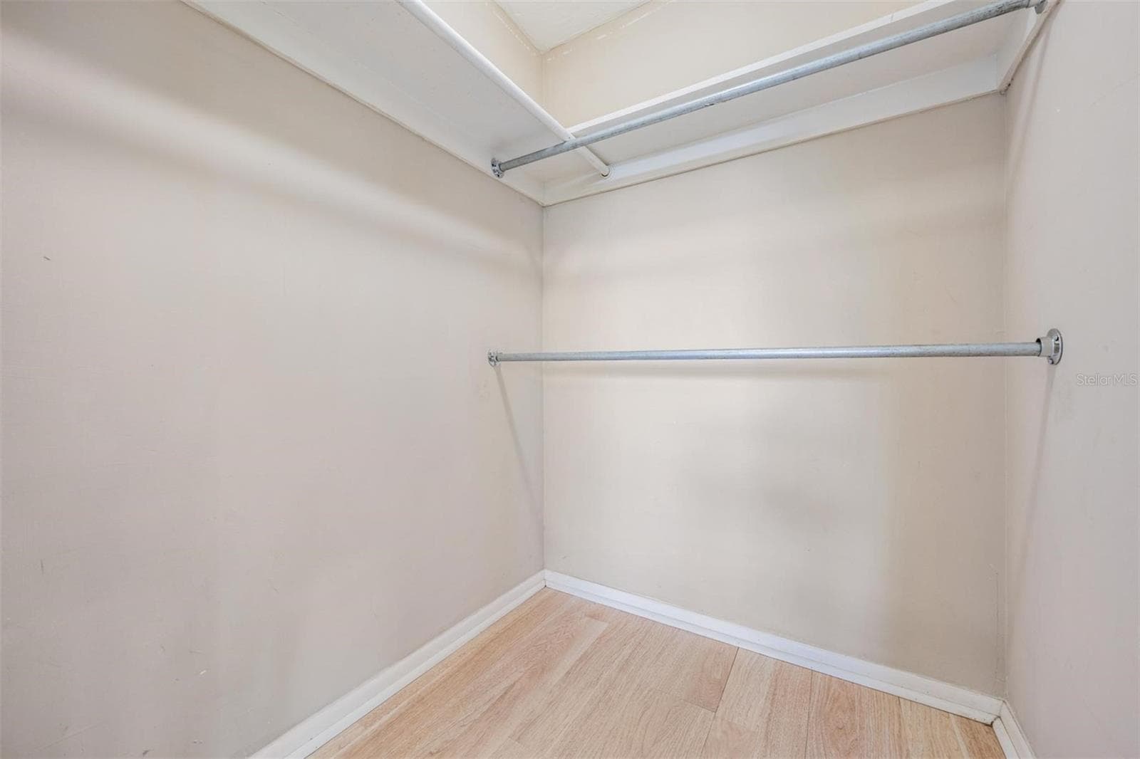 Primary bedroom walk-in closet - 7700 BIRCHWOOD DR, PORT RICHEY