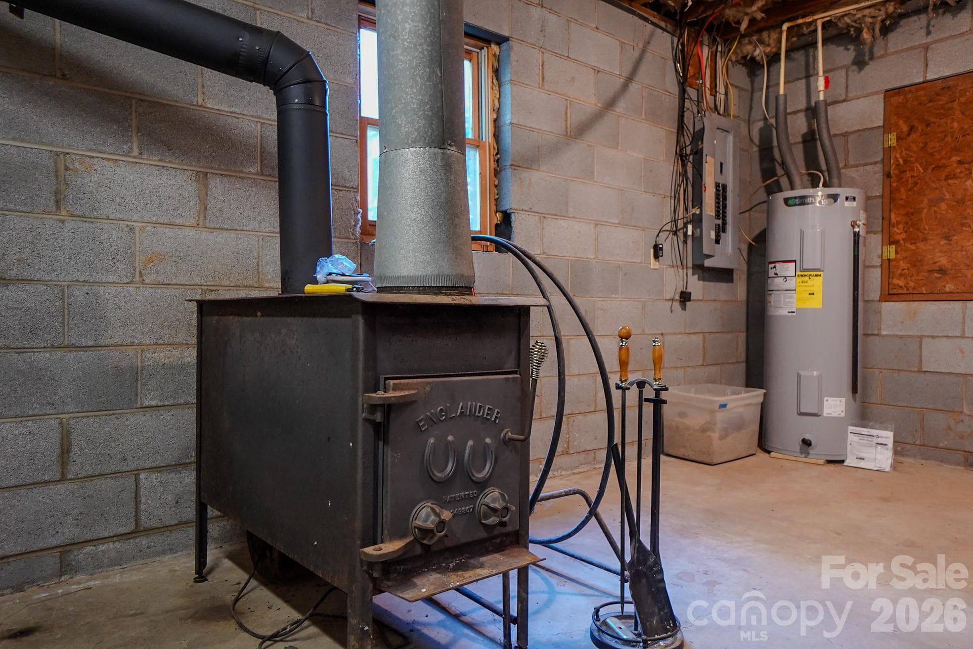 wood burning stove in basement remains - 3576 Julian Welborn Drive, Morganton