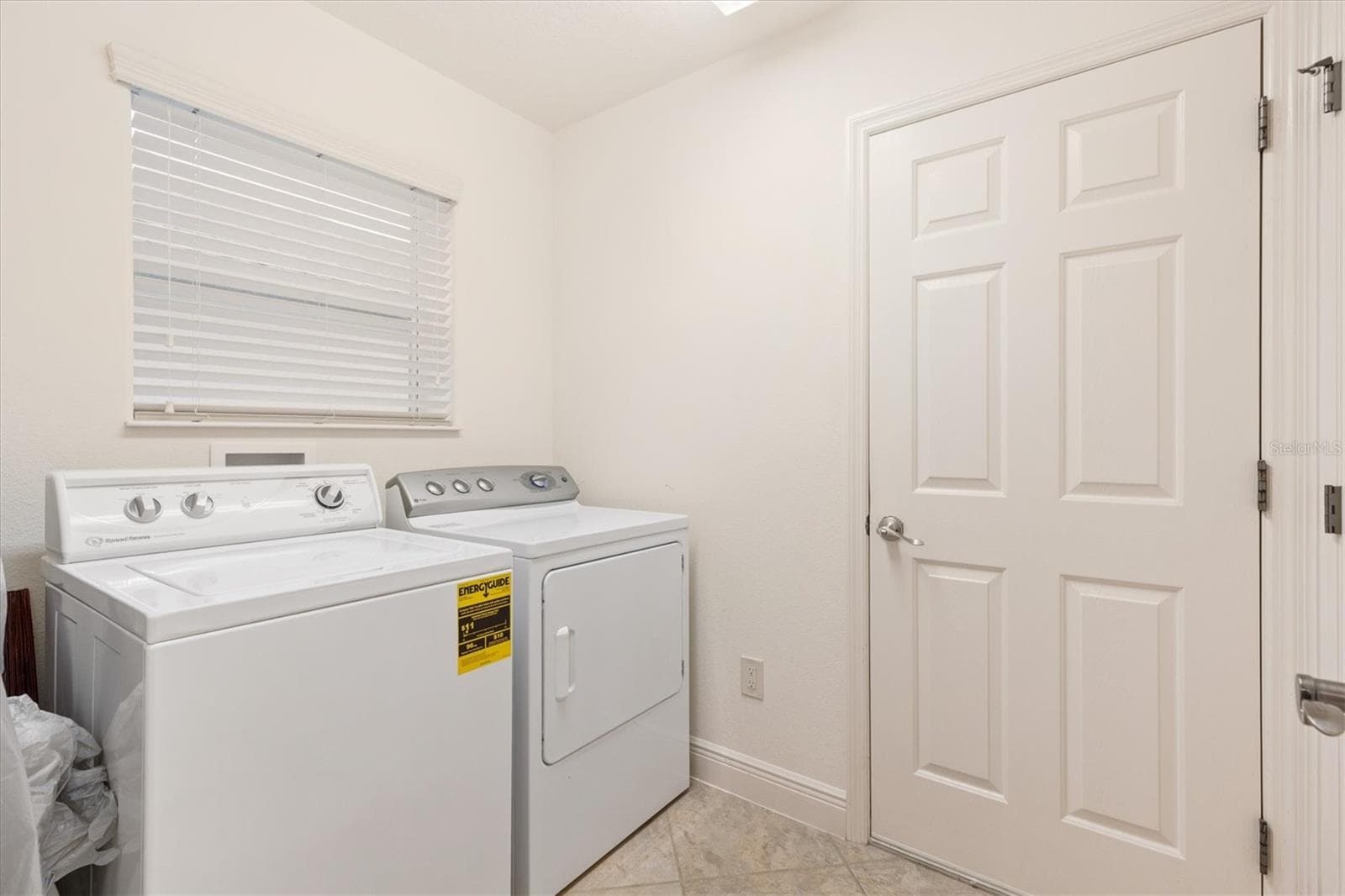 Inside laundry room with storage closet. - 1926 ELDRIDGE LOOP, THE VILLAGES