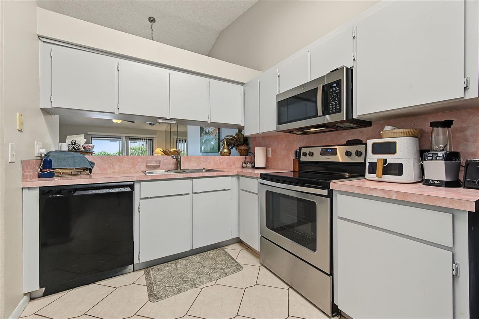 Large Kitchen with Pass through and breakfast bar - 2771 SUMMERDALE DR #7, CLEARWATER