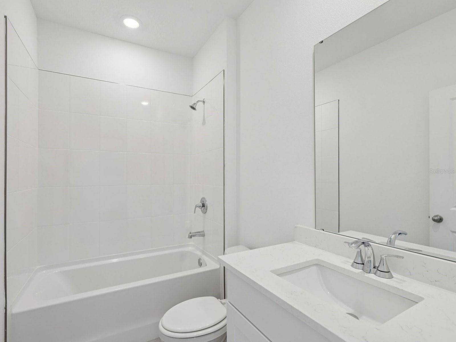 Photo is not of the actual home, but is an inspirational photo of builder’s model home and may depict options, furnishings, and/or decorator features that are not included. - 37 GARNI DR, PALM COAST