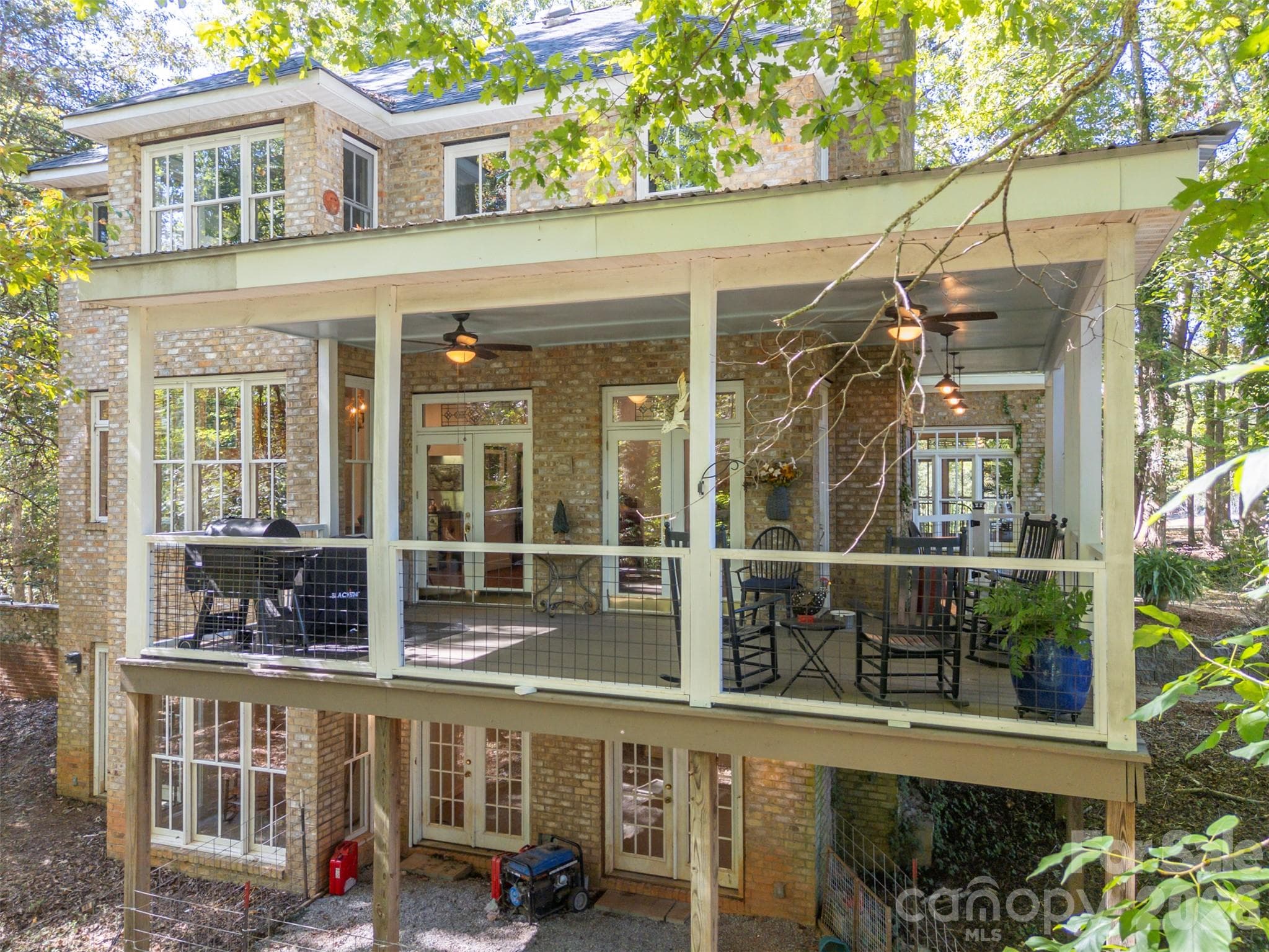 Rear View showing the 3 levels of the home.  The wrap around porch is great for entertaining guests - 600 John Weaver Road, Columbus