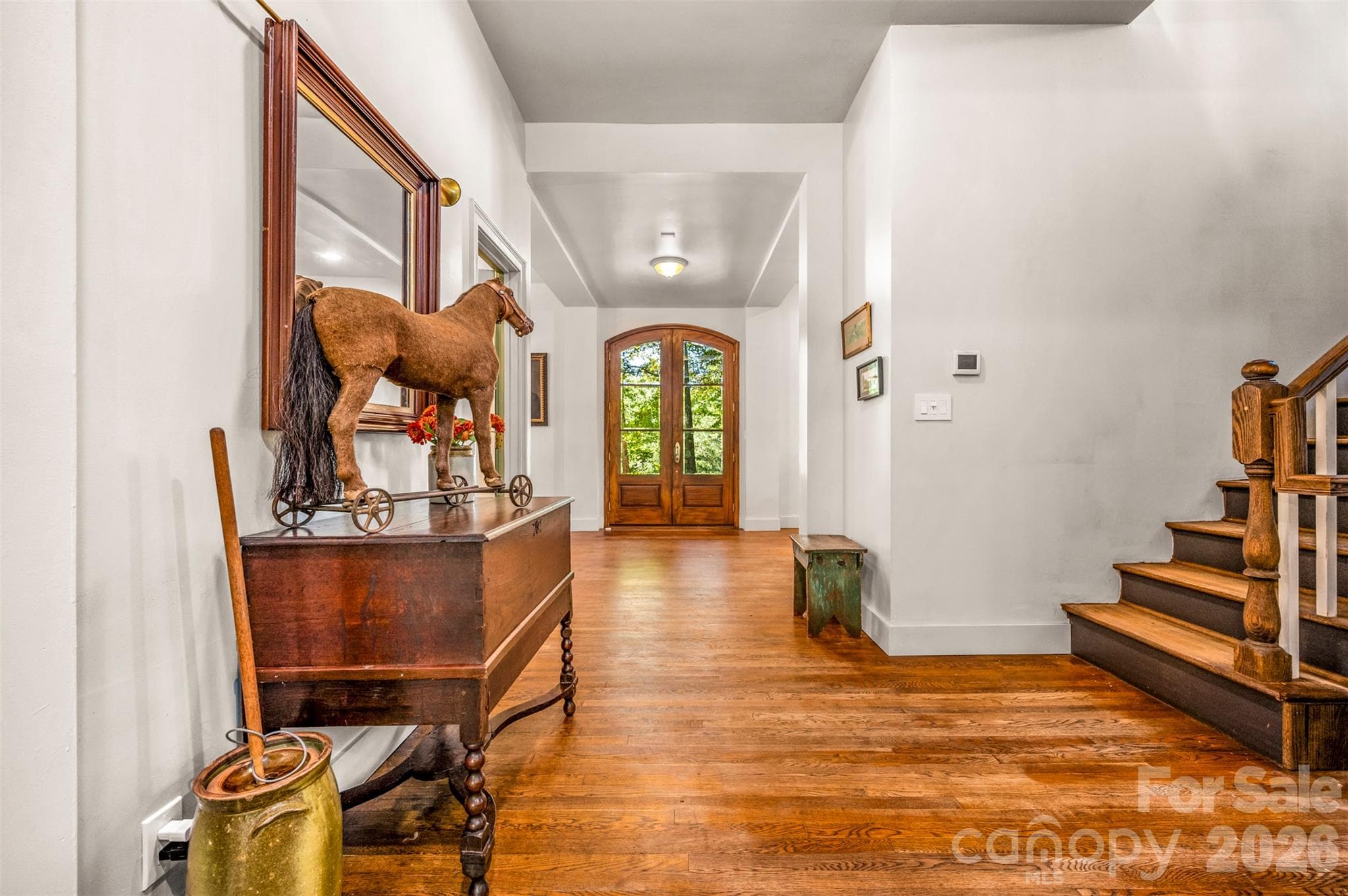 View from kitchen area to front door.  Stairs to the right for up and down levels. - 600 John Weaver Road, Columbus